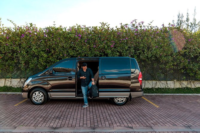 Private Transportation Service in Guatemala on a Minibus with A/C - Arrival in Antigua at the Pink Gate Exit: getting your bearings
